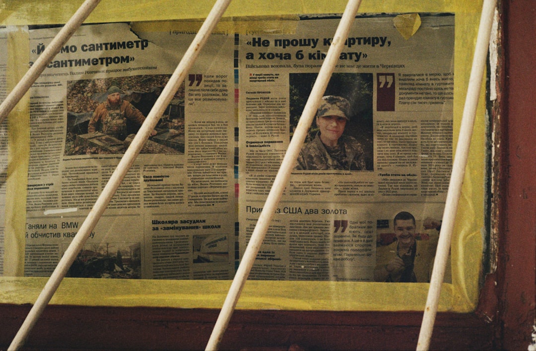 Newspaper articles displayed behind bars