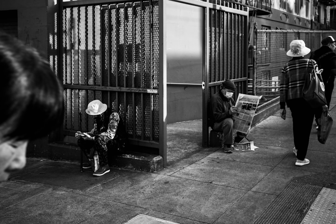People sitting and walking on a street